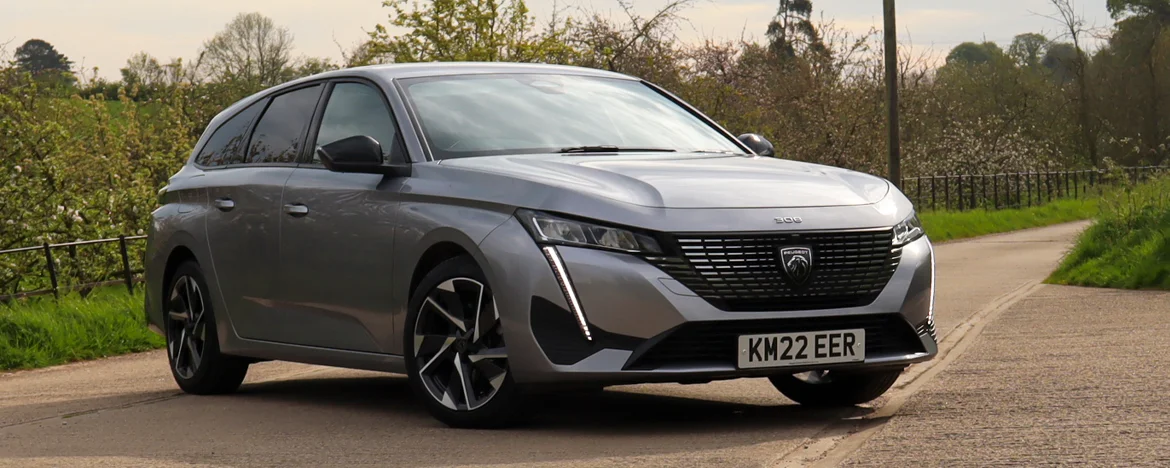 Peugeot 308 SW parked on country road