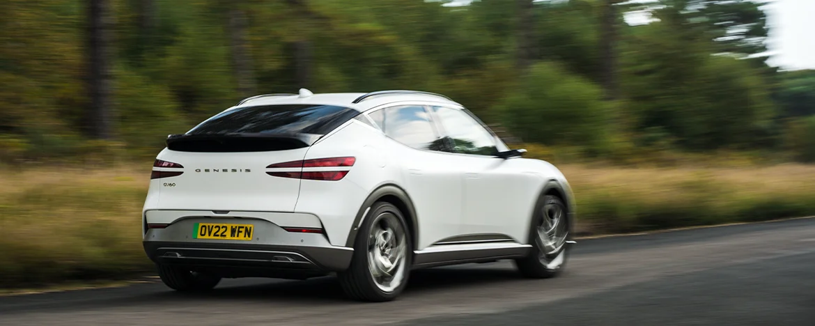 Genesis GV60 driving away