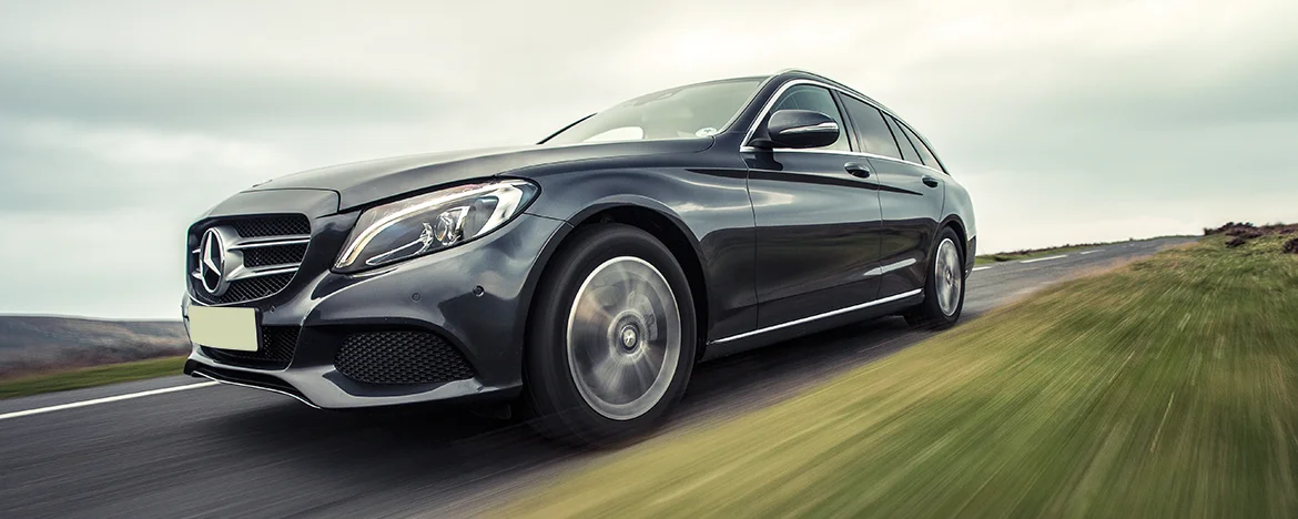 Mercedes C-Class Estate driving on country road 