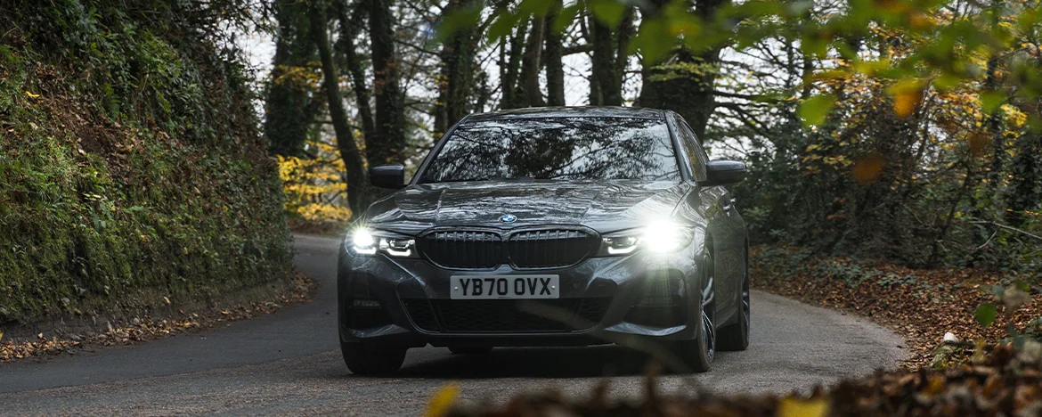 BMW 330e driving around corner