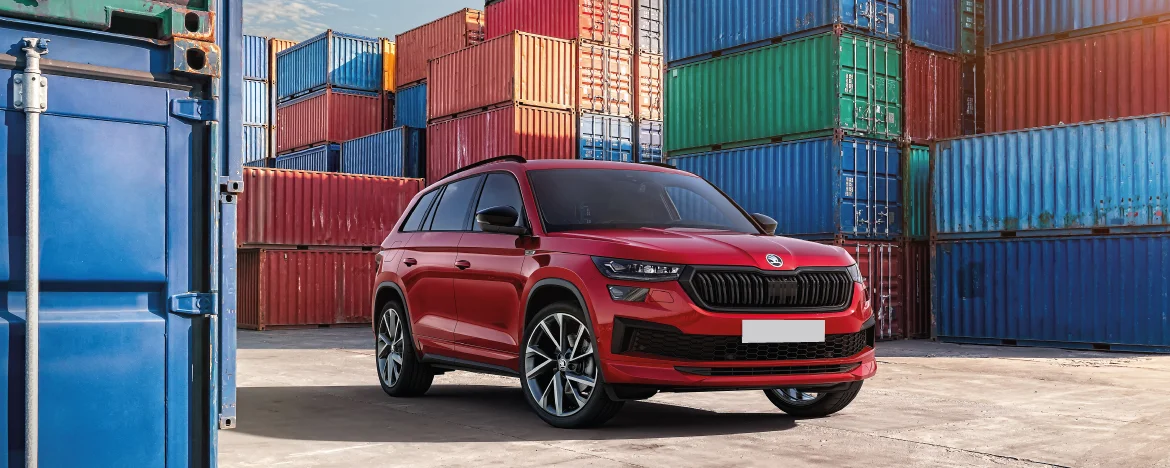 Skoda Kodiaq parked next to storage units 