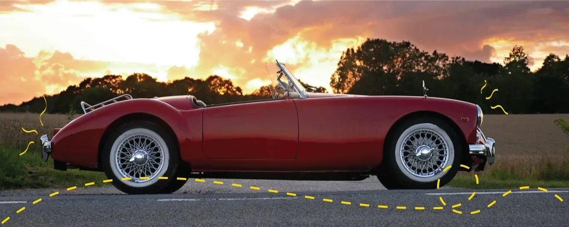 Red Triumph Spitfire on the road