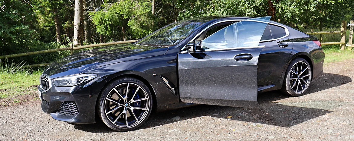 BMW 840 with door open 