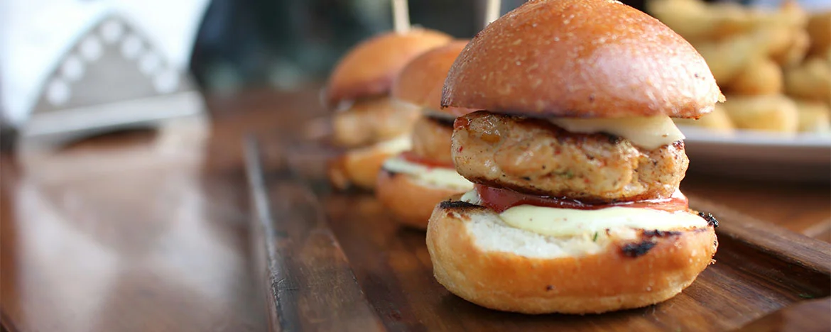 Line up of three burgers