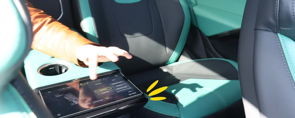 Woman using Lotus Eletre rear touchscreen