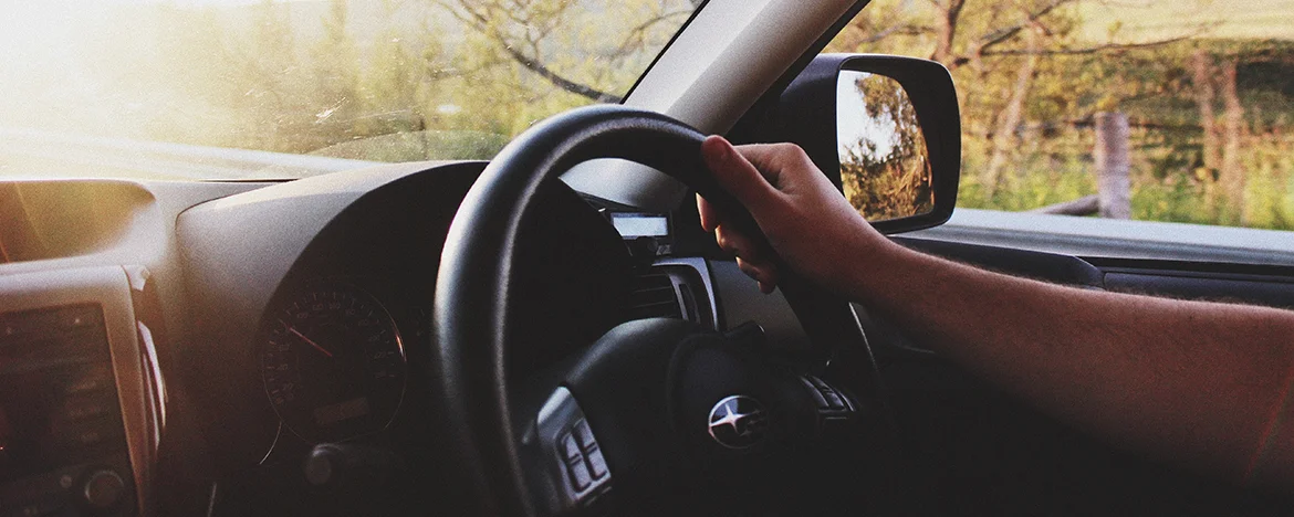 Hand on steering wheel