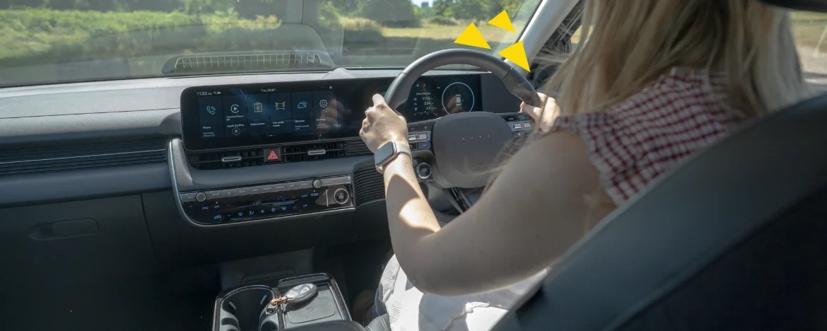 Woman driving electric car