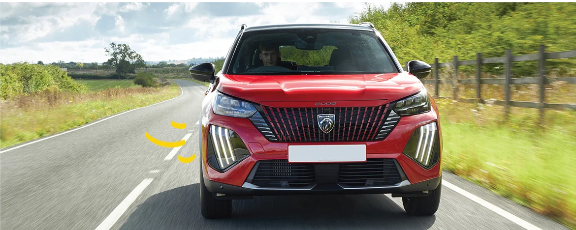 Front view of Peugeot 2008 on the road, with yellow accents