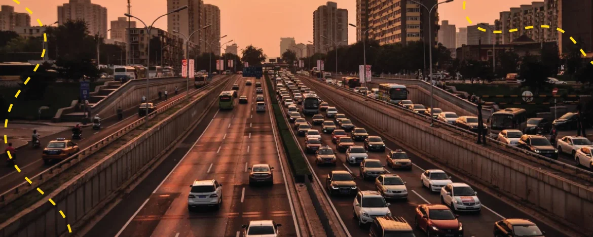 cars driving on busy road 