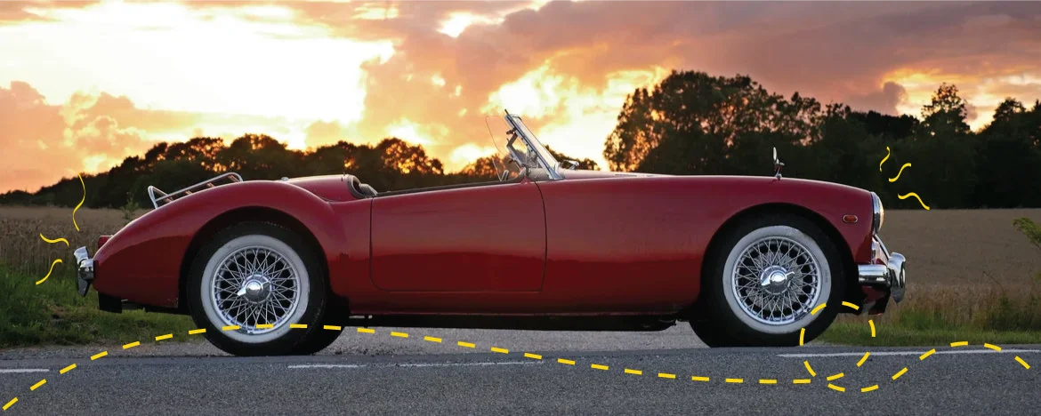 Red Triumph Spitfire on the road
