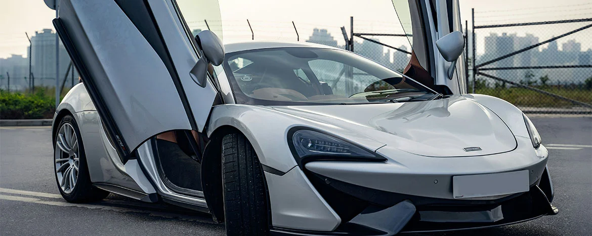 Parked supercar with falcon wing doors