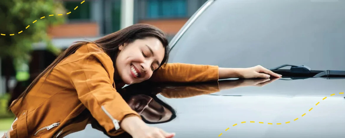 woman hugging car