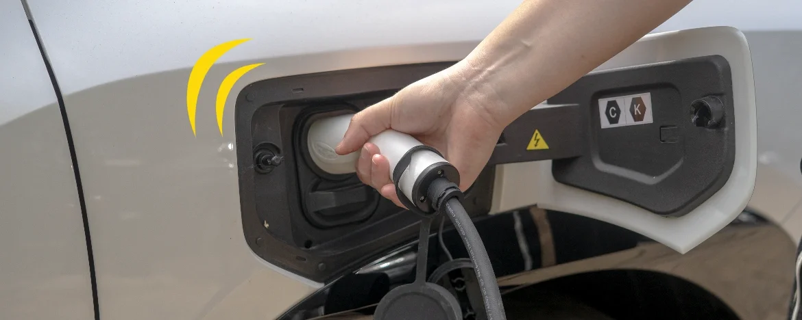 Person holding an Aion V charger