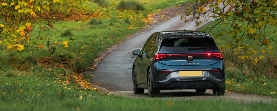 Rear body of the Cupra Born driving out of shot