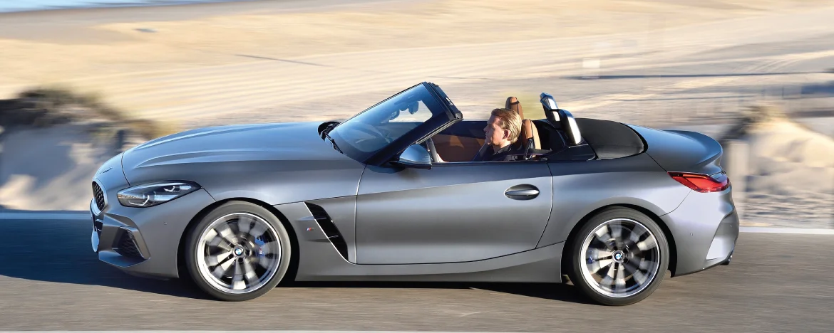 BMW z4 driving by the beach