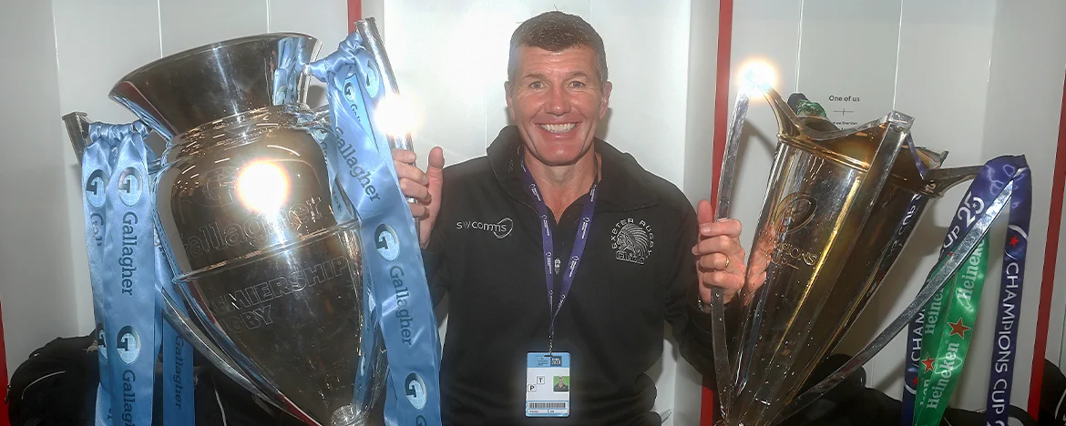 Rob Baxter holding trophies