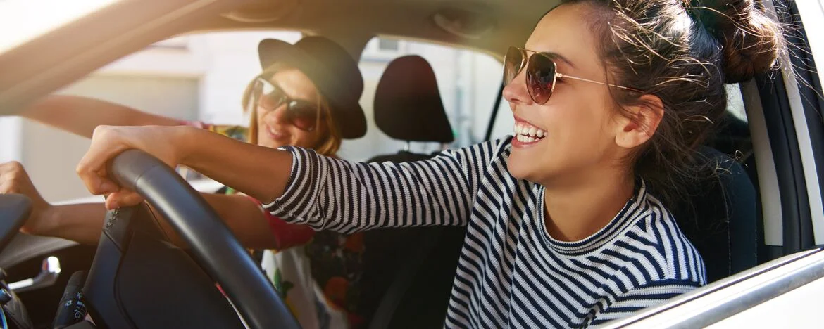 Woman driving with a passenger