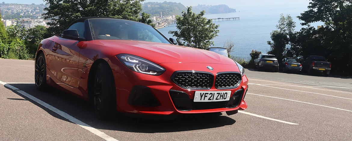 BMW Z4 parked under tree