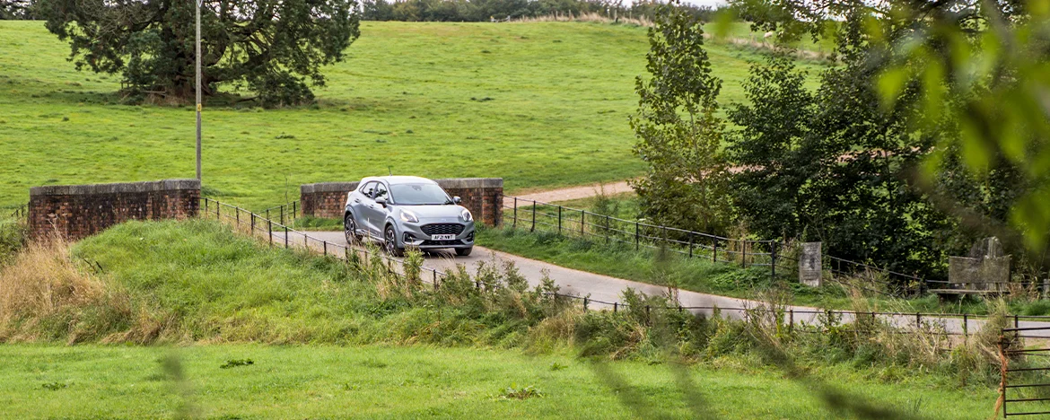 Ford Puma driving over bridge