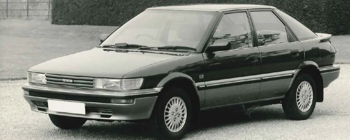 Monochrome photo of a Toyota Corolla liftback