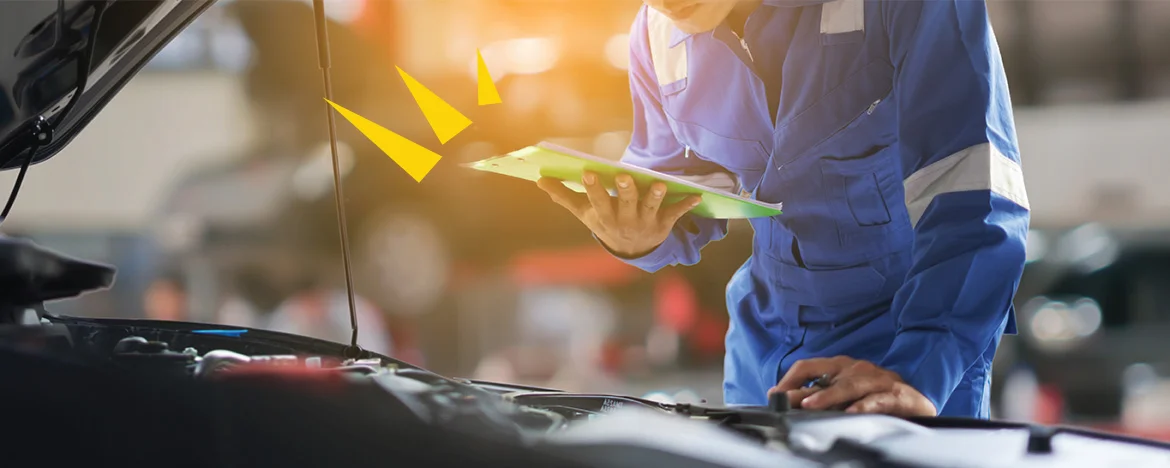 Person with clipboard making car checks