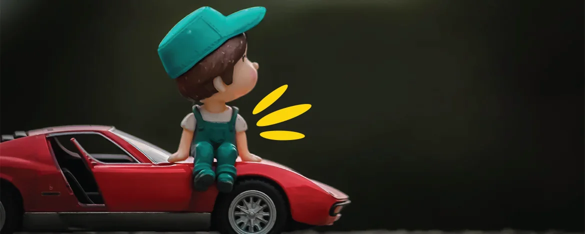 toy car with a toy person sat on top