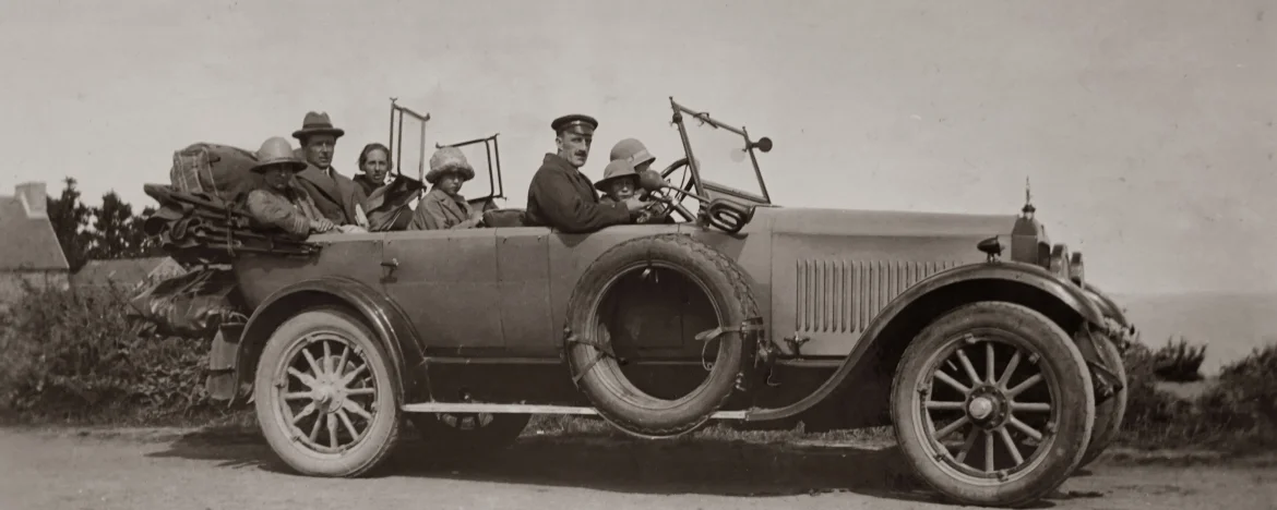 Group of people sitting in a vintage car