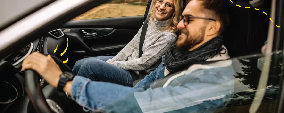 man driving with woman next to him