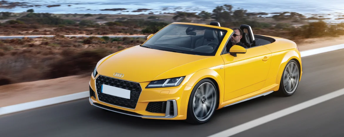 Audi TT Roadster driving on the coast 