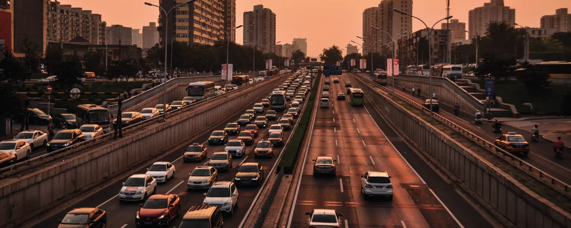 cars driving on busy road 