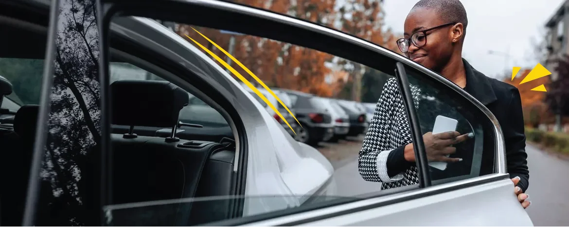woman dressed smart getting in car