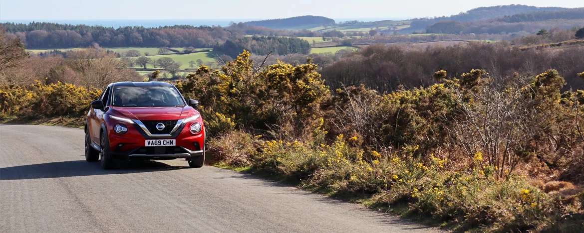 Nissan Juke driving through the countryside