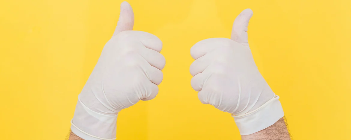 gloved hands thumbs up
