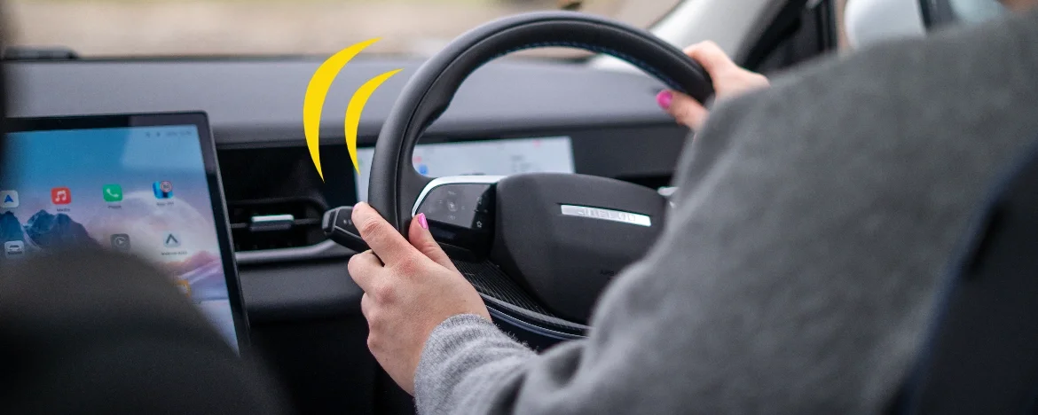 Woman driving a JAECOO