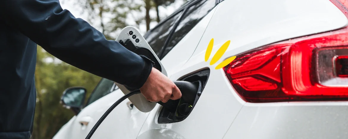 Man holding an EV charger