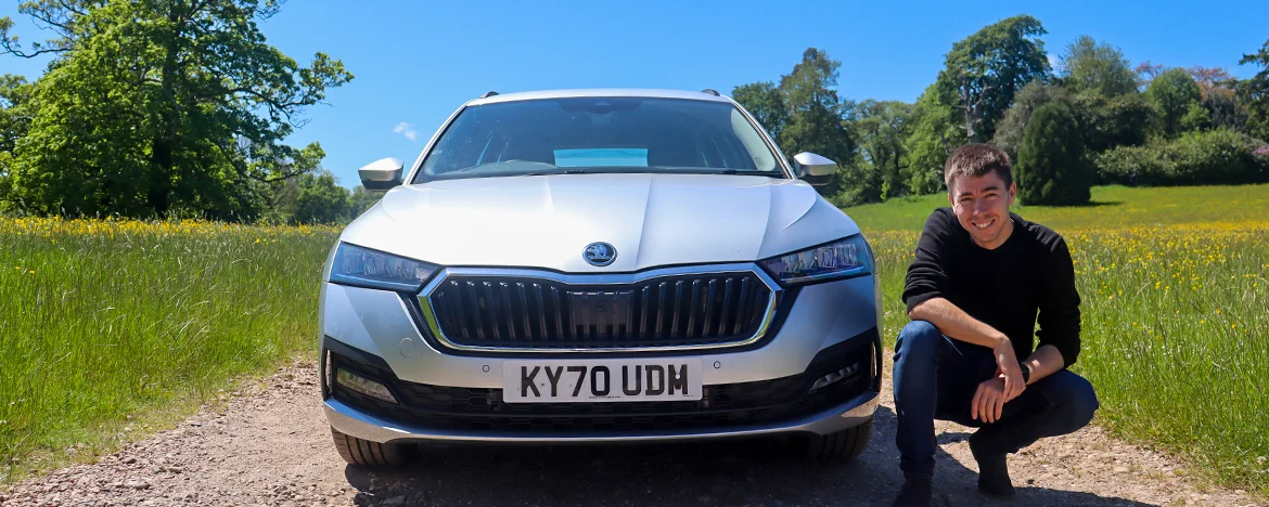 Man stood next to Skoda Octavia Estate