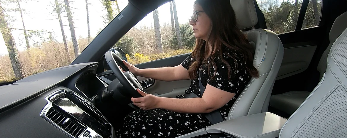 Woman driving Volvo XC90