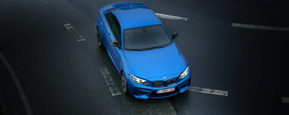 blue BMW driving