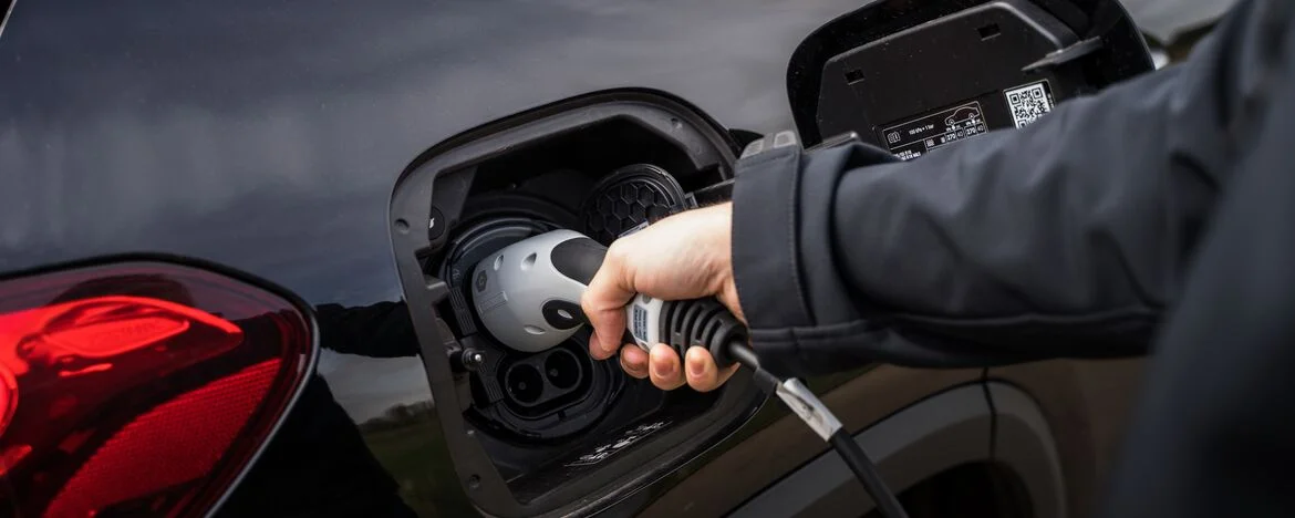 Man charging the Mercedes-Benz EQA