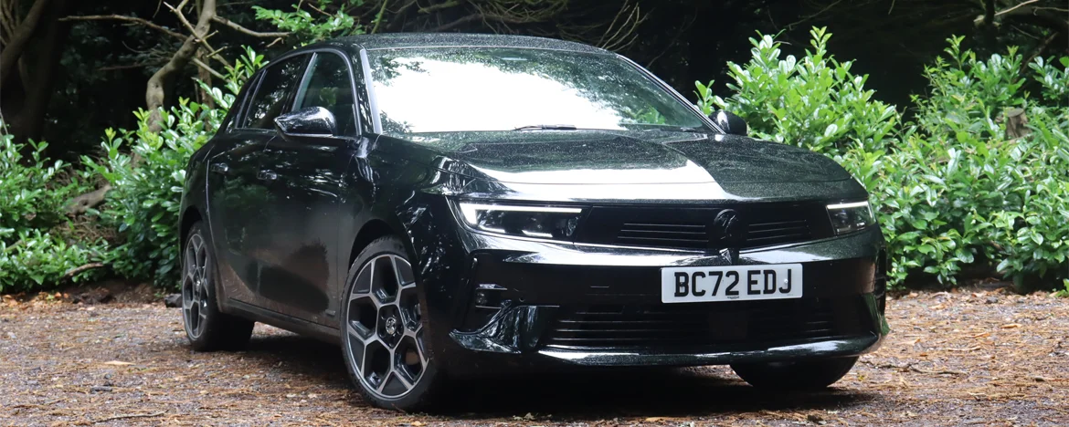 Vauxhall Astra parked in woodland forest