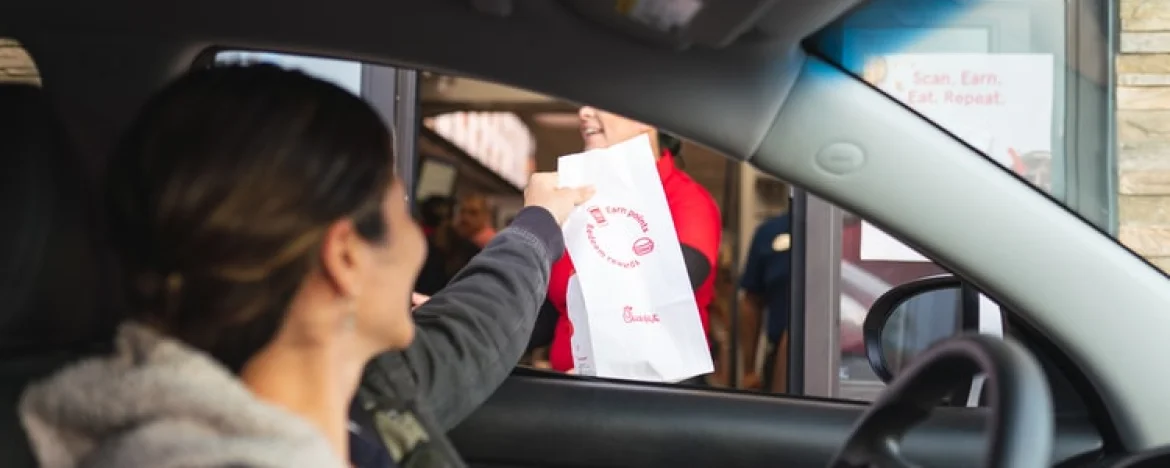 Person buying food at a drive through