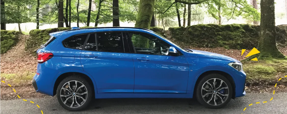  bmw-x1-parked-in-woods