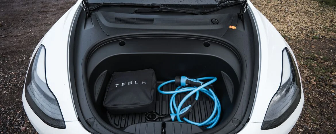 Tesla Model 3 'frunk' with charging cables in