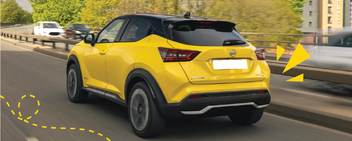 Rear view of Nissan Juke on road with yellow accents