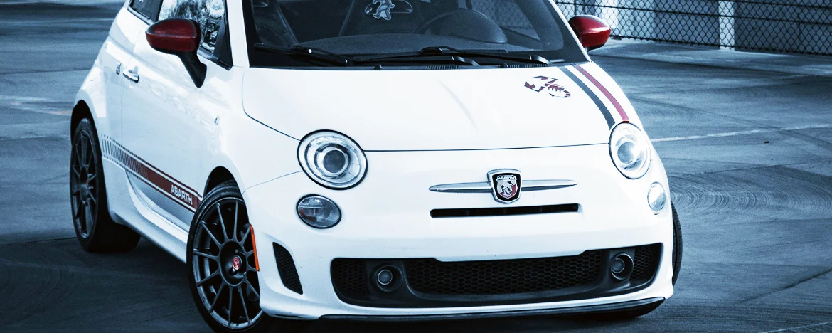White Abarth 595 parked