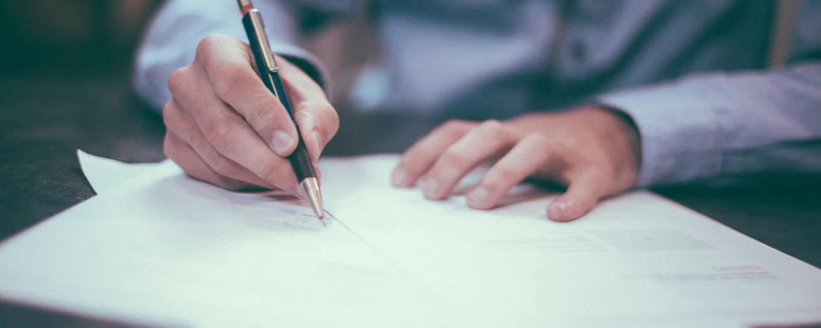 Person signing a contract