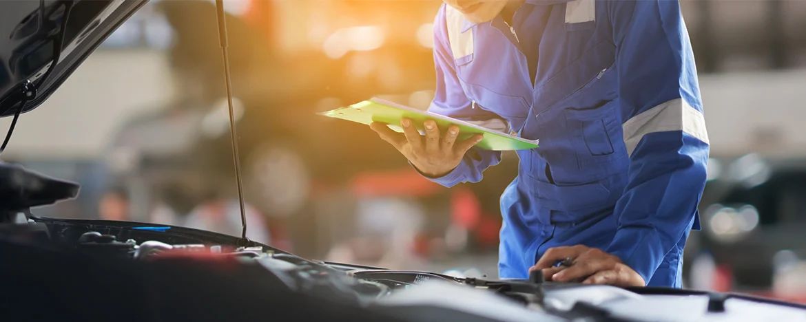 Person with clipboard making car checks