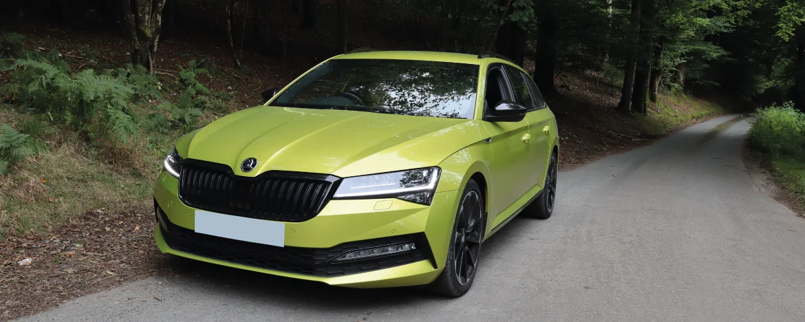 Skoda Superb parked on forest road 