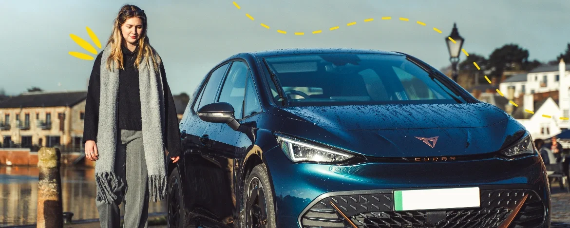 Woman walking past a CUPRA Born