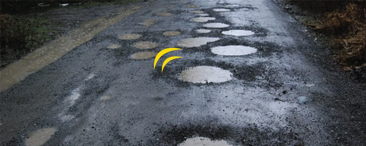 Potholes on tarmac road